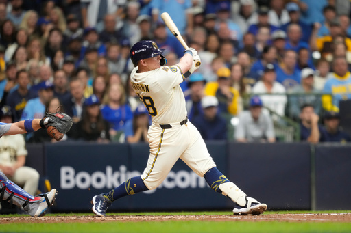 Milwaukee Brewers first baseman Andrew Vaughn (28) hits a solo home run against the Chicago Cubs during the fourth inning of Game 5 of baseball's National League Division Series, Saturday, Oct. 11, 2025, in Milwaukee. (AP Photo/Kayla Wolf) Milwaukee Brewers first baseman Andrew Vaughn (28) hits a solo home run against the Chicago Cubs during the fourth inning of Game 5 of baseball's National League Division Series, Saturday, Oct. 11, 2025, in Milwaukee. (AP Photo/Kayla Wolf)