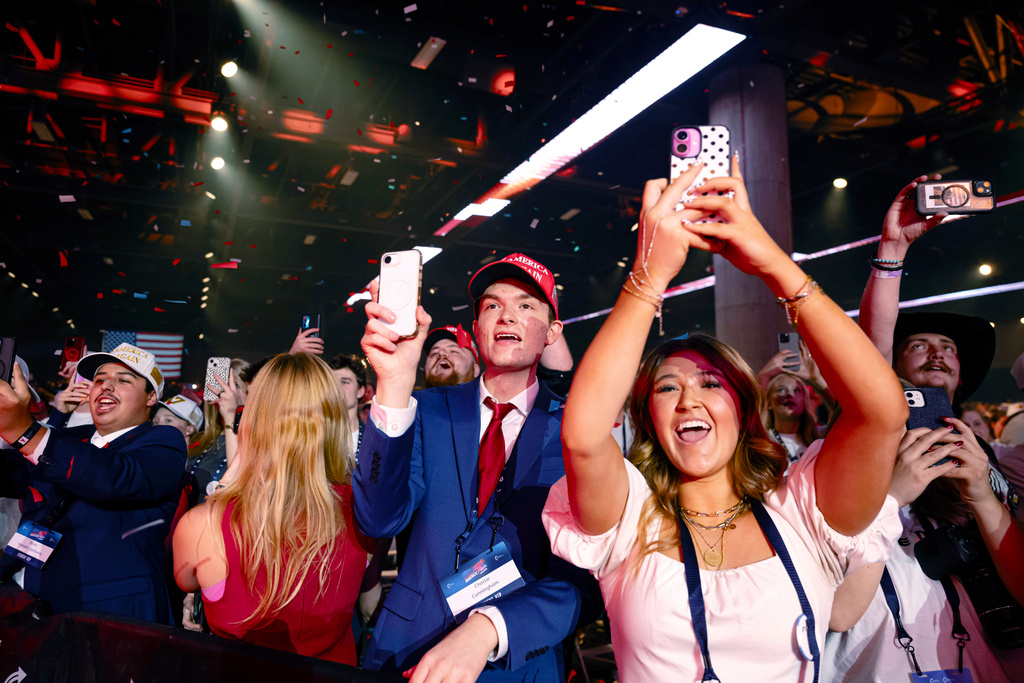 Supporters cheer during Turning Point USA's AmericaFest 2025, Sunday, Dec. 21, 2025, in Phoenix. (AP Photo/Jon Cherry)
