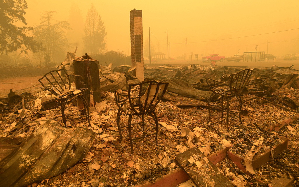 FILE - Chairs stand at a post office in the aftermath of the Santiam Fire, in Gates, Ore., Sept 9, 2020. (Mark Ylen/Albany Democrat-Herald via AP, File)