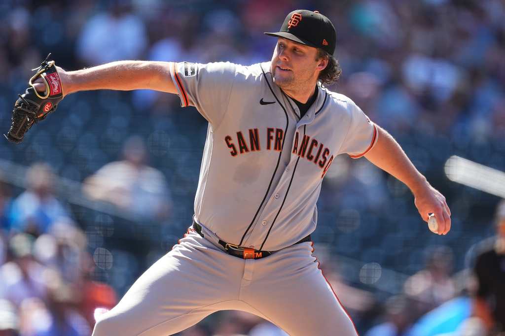 San Francisco Giants relief pitcher Erik Miller works against the Colorado Rockies in the sixth inning of a baseball game Sunday, July 5, 2026, in Denver. (AP Photo/David Zalubowski)