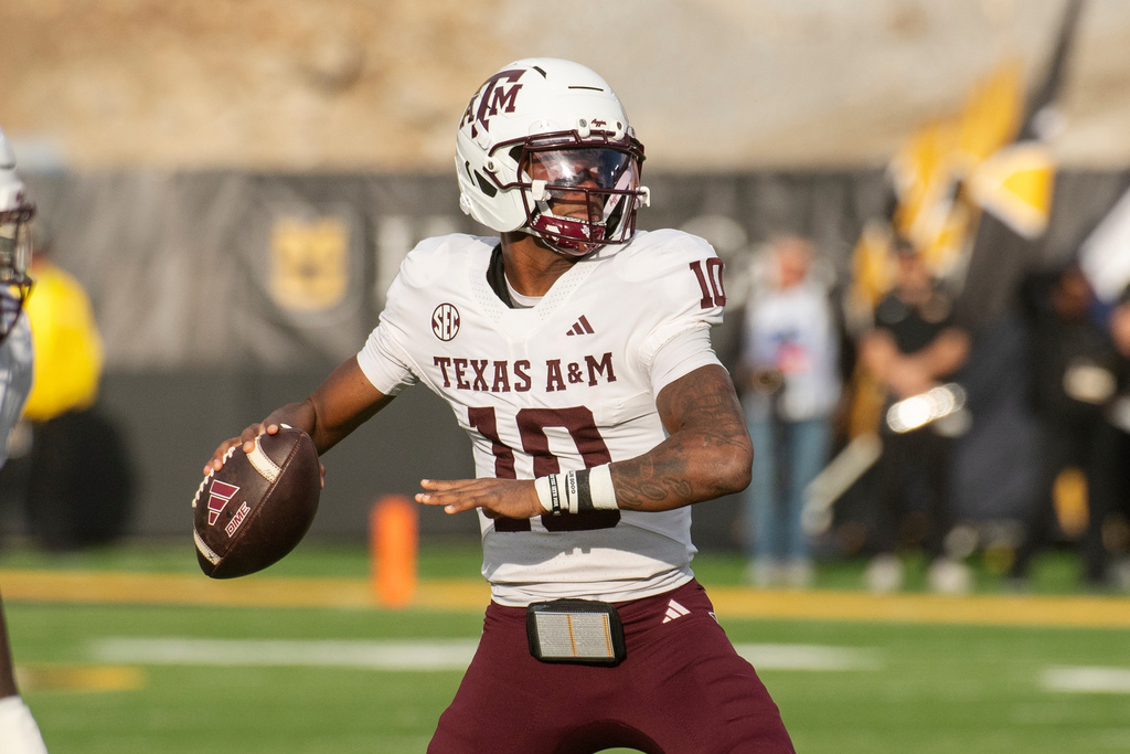 Texas A&M quarterback Marcel Reed looks to throw a pass during the first half an NCAA college football game against Missouri, Saturday, Nov. 8, 2025, in Columbia, Mo. (AP Photo/L.G. Patterson)