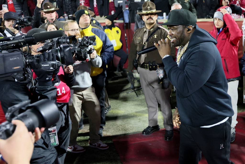 Rapper and actor 50 Cent performs during the second half in the first round of an NCAA College Football Playoff between Alabama and Oklahoma, Friday, Dec. 19, 2025, in Norman, Okla. (AP Photo/Nate Billings)