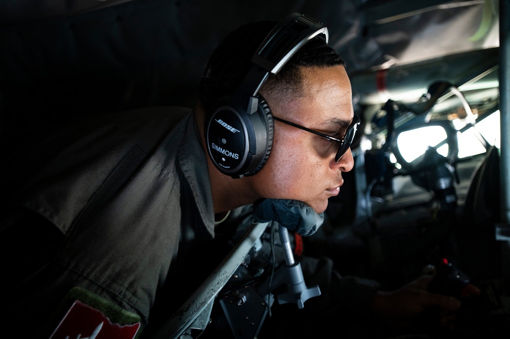 In this photo provided by the U.S. Air National Guard, U.S. Air Force Tech. Sgt. Tyler Simmons, an in-flight refueling specialist with the 121st Air Refueling Wing, refuels a C-17 Globemaster with a KC-135 Stratotanker during a teacher orientation flight at Rickenbacker Air National Guard Base, Ohio, on April 27, 2023. (Airman First Class Ivy Thomas/U.S. Air National Guard via AP)