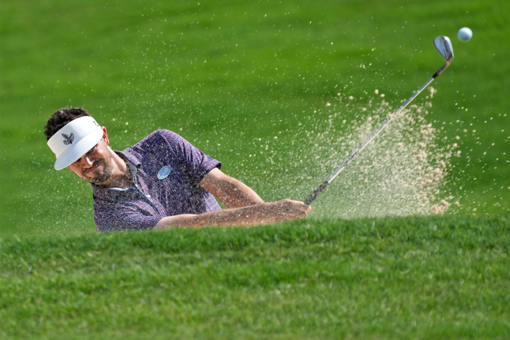 Beau Hossler hits from a sand trap on the ninth hole during the final round of the Wyndham Championship golf tournament in Greensboro, N.C., Sunday, Aug. 9, 2026. (AP Photo/Chuck Burton)