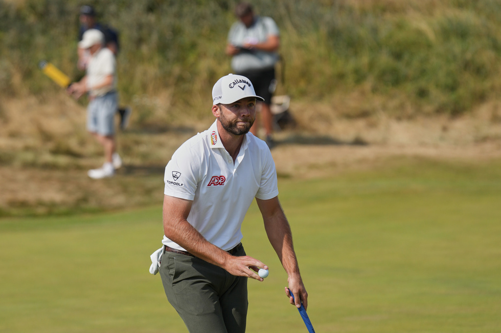 Sam Burns of the United States reacts after making a birdie on the 2nd green during the third day of the British Open Golf championships at Royal Birkdale golf club, in Southport, England, Saturday, July 18, 2026. (AP Photo/Jon Super)