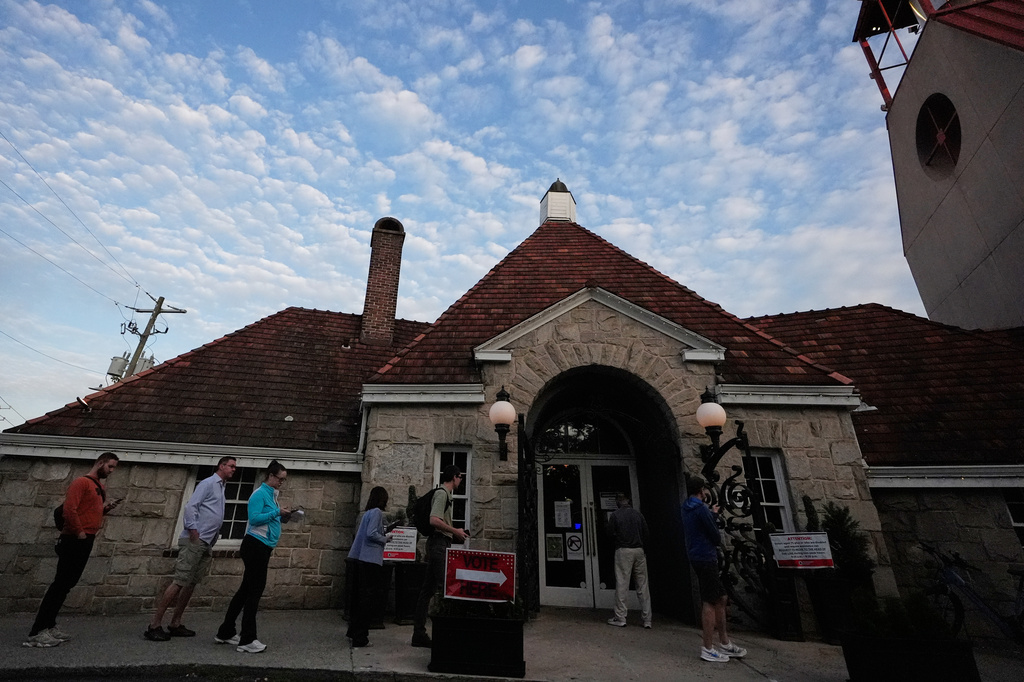 People wait in a line at a precinct before voting. Tuesday, May 19, 2026, in Atlanta. (AP Photo/Brynn Anderson)