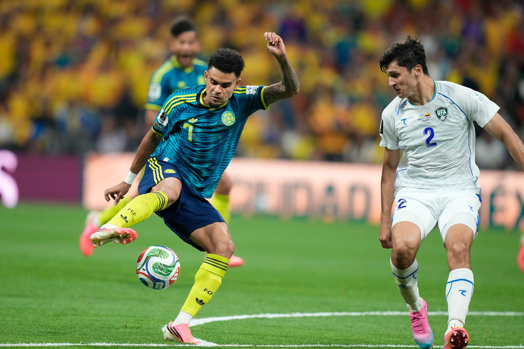 Colombia's Luis Diaz (7) controls the ball against Uzbekistan's Abdukodir Khusanov (2) during the World Cup Group K soccer match between Uzbekistan and Colombia in Mexico City, Wednesday, June 17, 2026. (AP Photo/Fernando Llano)