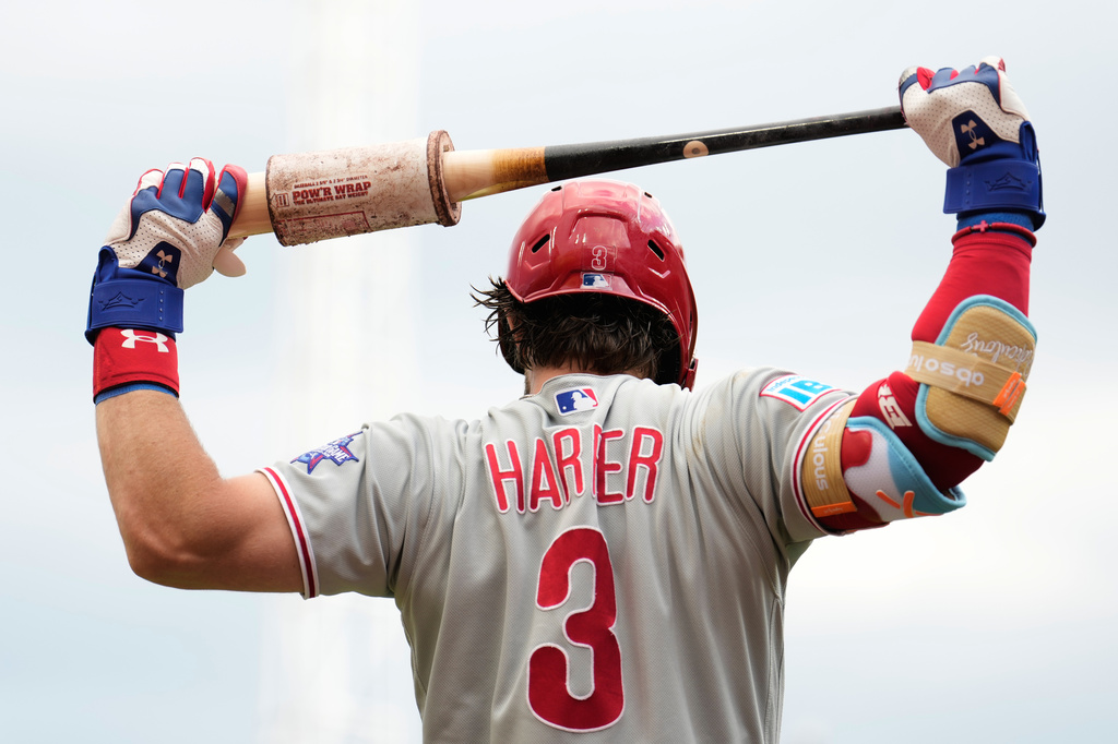 Philadelphia Phillies' Bryce Harper stretches with his bat during the first inning of a baseball game against the Cincinnati Reds in Cincinnati, Tuesday, July 7, 2026. (AP Photo/Carolyn Kaster)