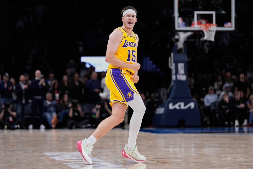 Los Angeles Lakers guard Austin Reaves (15) reacts during the second half of an NBA basketball game against the Minnesota Timberwolves, Wednesday, Oct. 29, 2025, in Minneapolis. (AP Photo/Abbie Parr)
