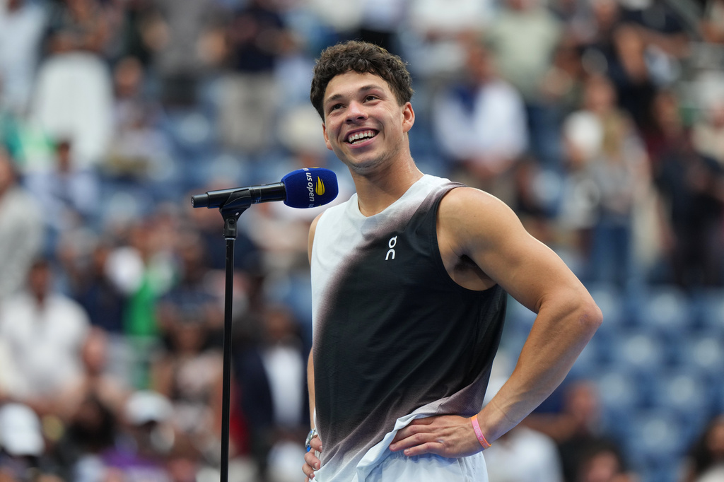 Ben Shelton, of the United States, speaks after he lost the men's singles final of the U.S. Open tennis championships against Alexander Zverev, of Germany, Sunday, Sept. 13, 2026, in New York. (AP Photo/Kirsty Wigglesworth)
