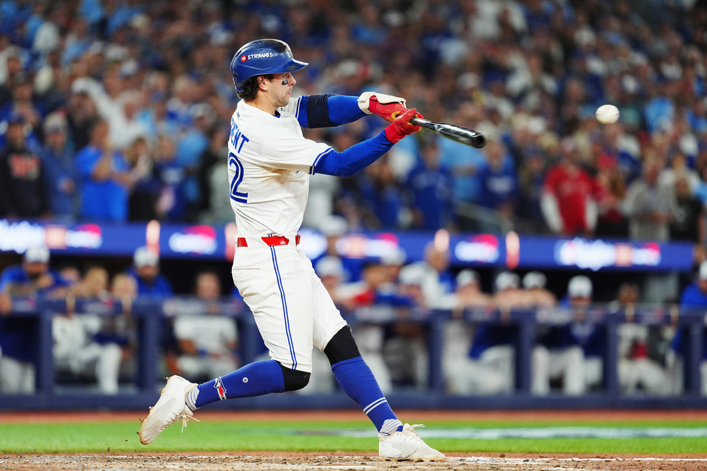 Toronto Blue Jays' Ernie Clement hits a double against the Los Angeles Dodgers during the eighth inning in Game 7 of baseball's World Series in Toronto on Saturday, Nov. 1, 2025. (Frank Gunn/The Canadian Press via AP)