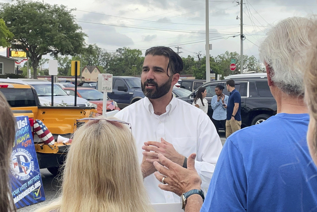 FILE - Josh Weil talks to a group of supporters during a Get Out the Vote event in Ocala, Fla., Monday, March 31, 2025. (AP Photo/Stephany Matat, file)