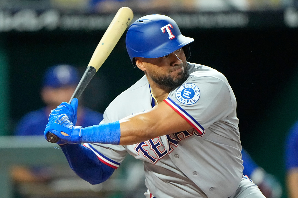 Texas Rangers' Elias Diaz waits to hit an RBI double during the 10th inning of a baseball game against the Kansas City Royals, Wednesday, June 10, 2026, in Kansas City, Mo. (AP Photo/Charlie Riedel)