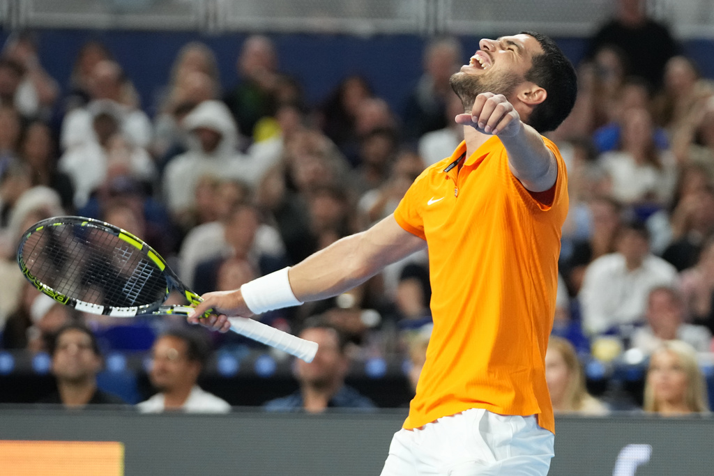 Carlos Alcaraz reacts after winning the first set against Joao Fonseca during the Miami Tennis Invitational tournament, Monday, Dec. 8, 2025, in Miami. (AP Photo/Lynne Sladky)