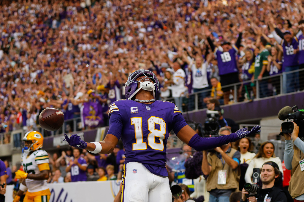 Minnesota Vikings wide receiver Justin Jefferson (18) celebrates after catching two-point conversion pass during the second half of an NFL football game against the Green Bay Packers, Sunday, Sept. 13, 2026, in Minneapolis, Minn. (AP Photo/Bailey Hillesheim)