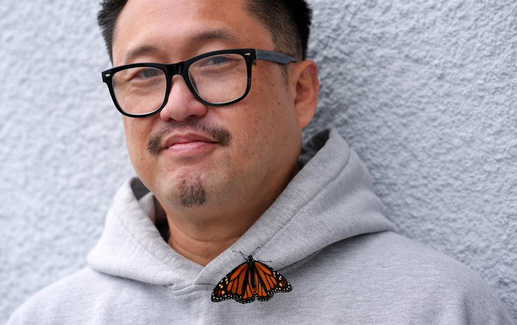 Director Ian Tuason is joined by a butterfly as he poses for a portrait to promote the film "Undertone" on Wednesday, March 4, 2026, in West Hollywood, Calif. (AP Photo/Chris Pizzello)