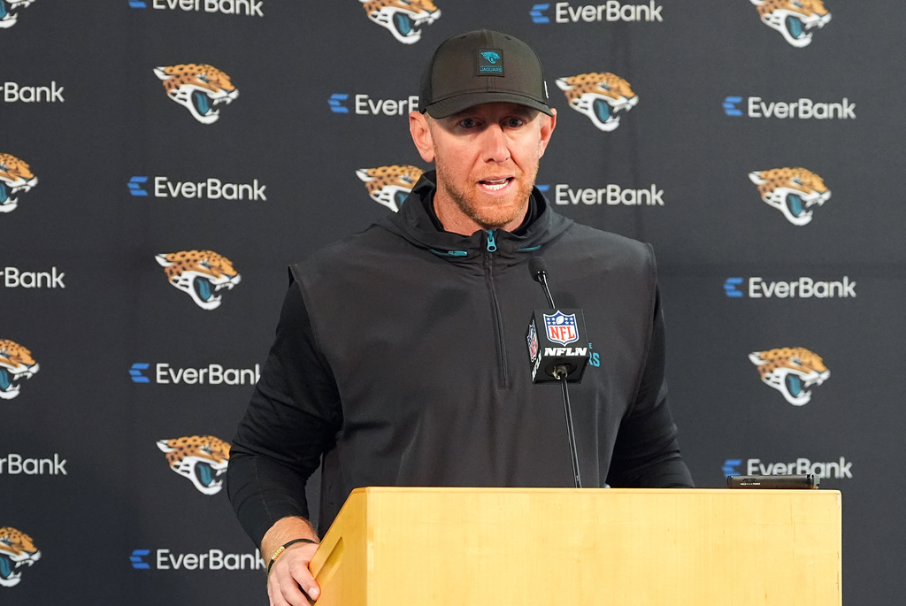 Jacksonville Jaguars head coach Liam Coen speaks during a news conference after an NFL football game against the Denver Broncos in Denver, Sunday, Dec. 21, 2025. (AP Photo/David Zalubowski)
