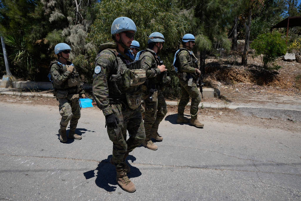 Spanish U.N peacekeepers patrol at an entrance of Dibbine village, southeast Lebanon, Friday, June 5, 2026, a day after Israeli forces withdrew following intense clashes with Hezbollah fighters. (AP Photo/Hussein Malla)