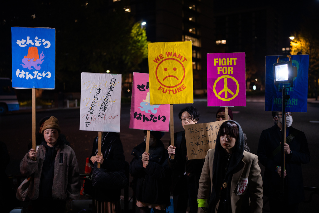 FILE - Protesters gather outside the prime minister's office to oppose Prime Minister Sanae Takaichi's remarks on Taiwan, in Tokyo, Friday, Nov. 21, 2025. (AP Photo/Louise Delmotte, File)