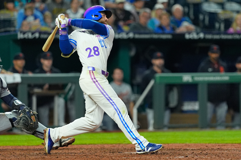 Kansas City Royals' Kyle Isbel watches his single to drive in the game-winning run during the ninth inning of a baseball game against the Detroit Tigers, Friday, May 8, 2026, in Kansas City, Mo. (AP Photo/Charlie Riedel)