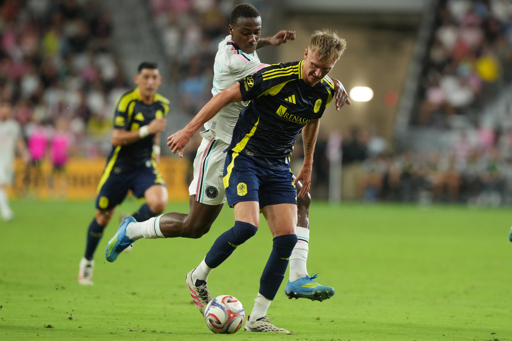 Inter Miami defender Fricio Caicedo (15) defends Nashville forward Sam Surridge (9) during the first half of an MLS soccer match, Saturday, Sept. 12, 2026, in Miami. (AP Photo/Marta Lavandier)