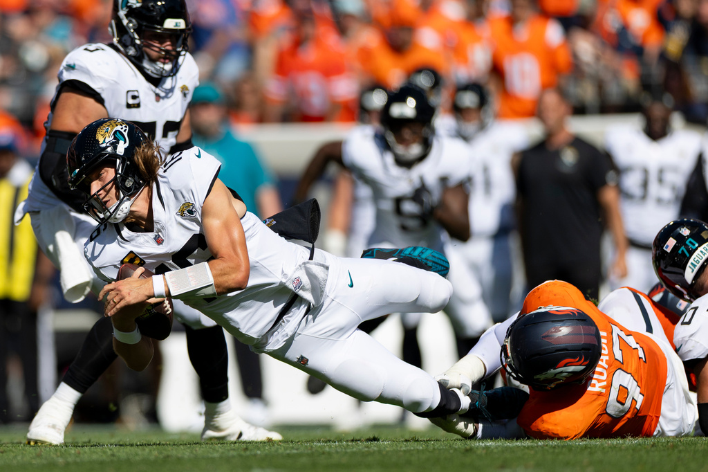 Denver Broncos defensive tackle Malcolm Roach (97) sacks Jacksonville Jaguars quarterback Trevor Lawrence (16) during an NFL football game against the Jacksonville Jaguars, Sunday, Sept. 20, 2026 in Denver. (Gabriel Christus/Denver Broncos via AP)