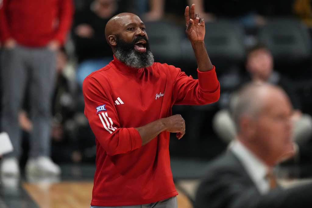 Kansas assistant coach Jacque Vaughn, filling in for head coach Bill Self, directs players in the first half of an NCAA college basketball game against Colorado Tuesday, Jan. 20, 2026, in Boulder, Colo. (AP Photo/David Zalubowski)