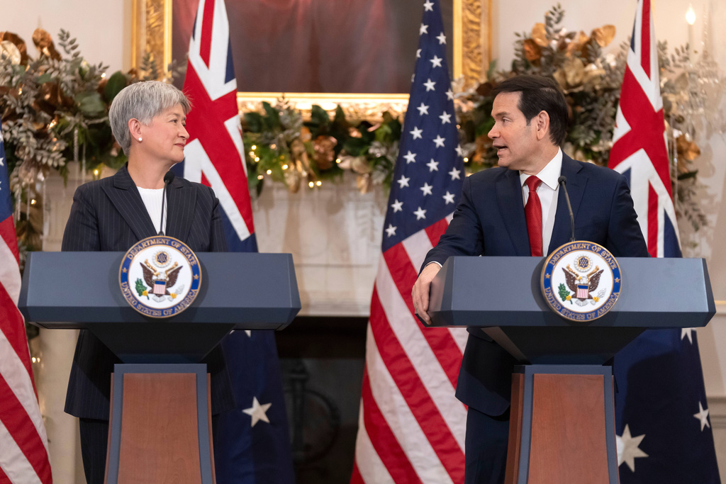 Australia's Foreign Minister Penny Wong, left, listens as Secretary of State Marco Rubio speaks at the State Department, Monday, Dec. 8, 2025, in Washington. (AP Photo/Mark Schiefelbein)