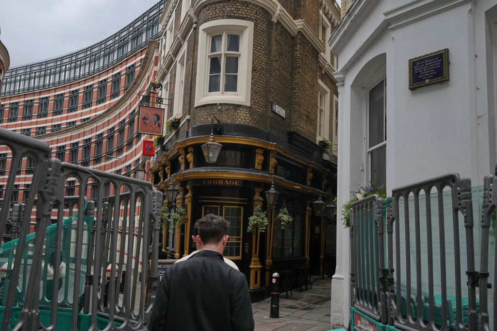 A plaque erected by the City of London to commemorate where William Shakespeare lived on a wall, top right, is pictured in London, Wednesday, April 15, 2026, he purchased lodgings in the Blackfriars Gatehouse, which was located close by. (AP Photo/Alastair Grant)