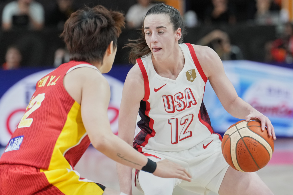 China's Li Yuan guards United States' Caitlin Clark during the Women's Basketball World Cup match between China and the United States in Berlin, Friday, Sept. 4, 2026. (AP Photo/Ebrahim Noroozi)