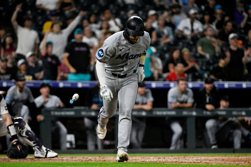 Miami Marlins' Joe Mack begins rounding the bases after hitting a home run in the seventh inning of a baseball game against the Colorado Rockies Tuesday, June 30, 2026, in Denver. (AP Photo/Geneva Heffernan)