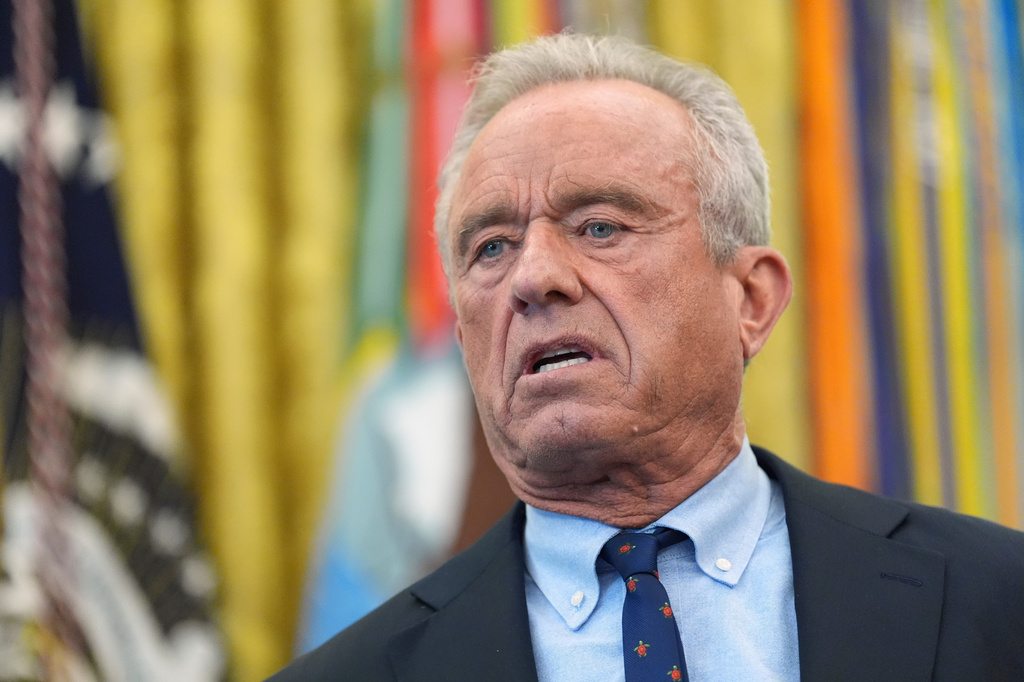 Health and Human Services Secretary Robert F. Kennedy Jr. speaks during a meeting to sign an executive order about vaccines, Monday, Aug. 10, 2026, in the Oval Office of the White House in Washington. (AP Photo/Jacquelyn Martin)
