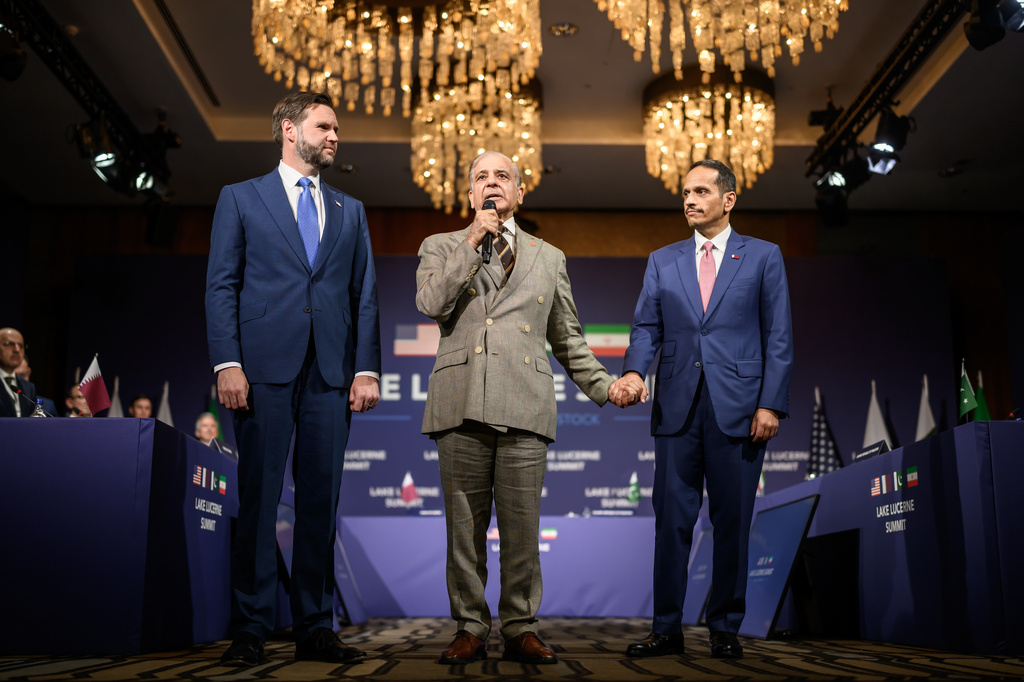 Pakistan's Prime Minister Shehbaz Sharif, center, speaks between US Vice President JD Vance, left, and Qatar's Prime Minister Sheikh Mohammed bin Abdulrahman bin Jassim al-Thani prior to a quadrilateral meeting between the United States, Iran, Pakistan and Qatar at the Burgenstock luxury hotel complex overlooking Lake Lucerne, Switzerland, Sunday June 21, 2026. (Fabrice Coffrini/Keystone via AP)