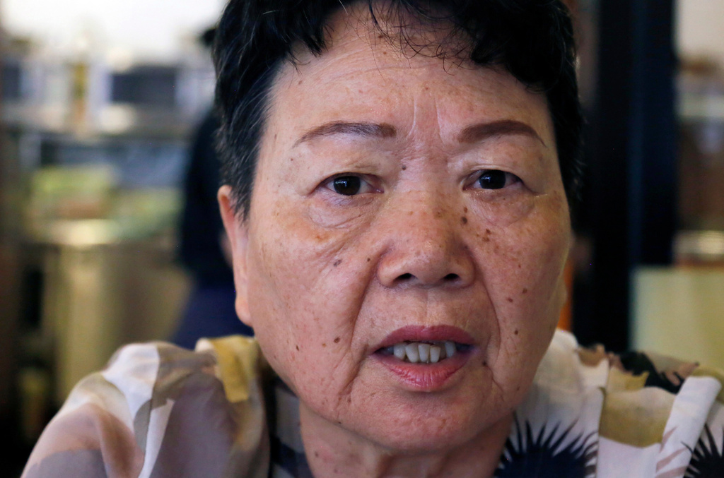 FILE - Eiko Kawasaki, a Korean born in Japan, speaks during an interview in Tokyo Friday, Aug. 24, 2018. (AP Photo/Yuri Kageyama, file)
