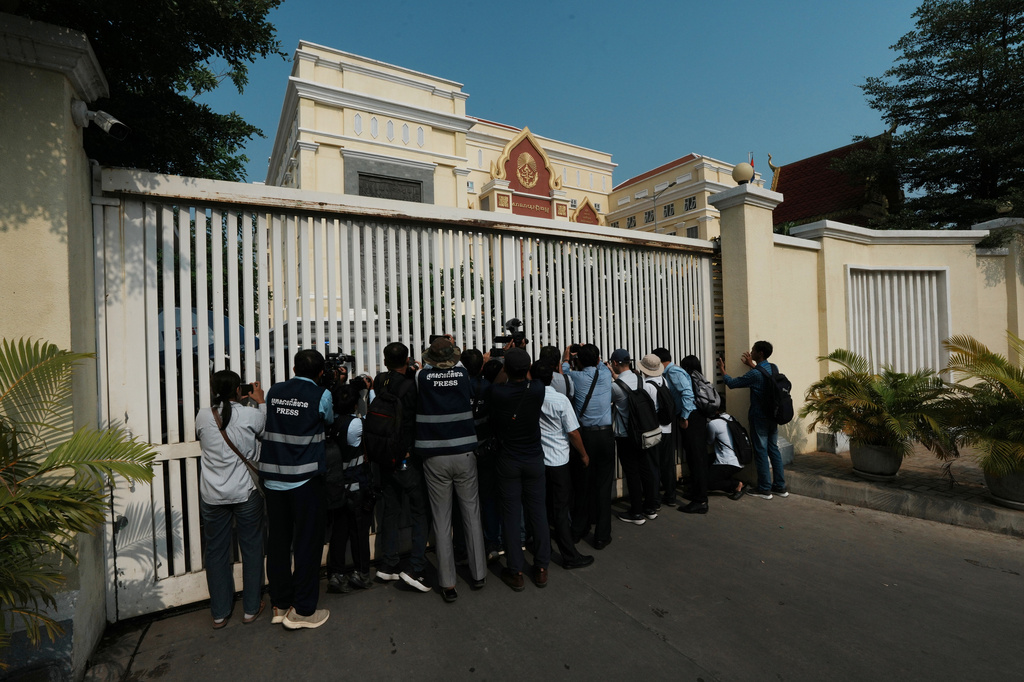 Journalists photograph after a court session of former Cambodia National Rescue Party's President Kem Sokha outside an appeals court in Phnom Penh, Cambodia, Thursday, April 30, 2026. (AP Photo/Heng Sinith)
