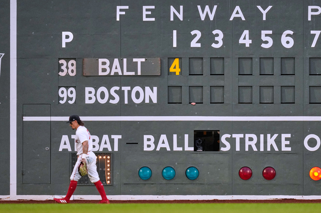 Boston Red Sox's Jarren Duran passes the scoreboard while trailing the Baltimore Orioles by four runs in the top of the first inning during the second baseball game of a doubleheader, Wednesday, July 22, 2026, in Boston. (AP Photo/Charles Krupa)
