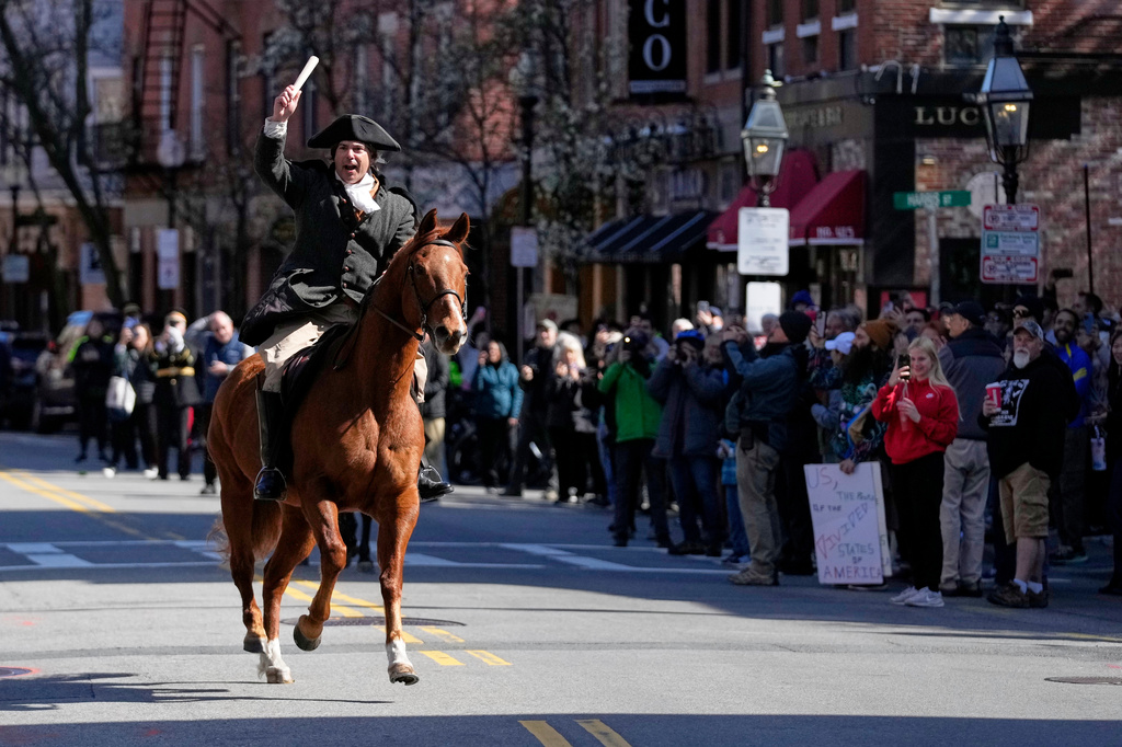 Brig. Gen. Richard Reale, dressed as American patriot Paul Revere reenacts the 1775 Boston-to-Lexington ride to alert colonists of approaching British troops, Monday, April 20, 2026, in Boston. (AP Photo/Robert F. Bukaty)