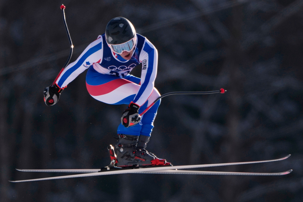 France's Alban Elezi Cannaferina is airborne as he speeds down the course during the alpine ski, men's downhill second official training, at the 2026 Winter Olympics, in Bormio, Italy, Thursday, Feb. 5, 2026. (AP Photo/John Locher)