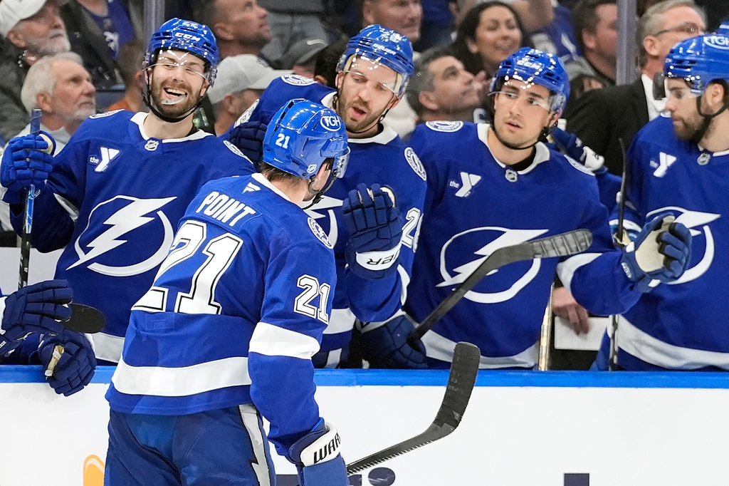 Tampa Bay Lightning center Brayden Point (21) celebrates with the bench after his goal against the Toronto Maple Leafs during the second period of an NHL hockey game Wednesday, Feb. 25, 2026, in Tampa, Fla. (AP Photo/Chris O'Meara)