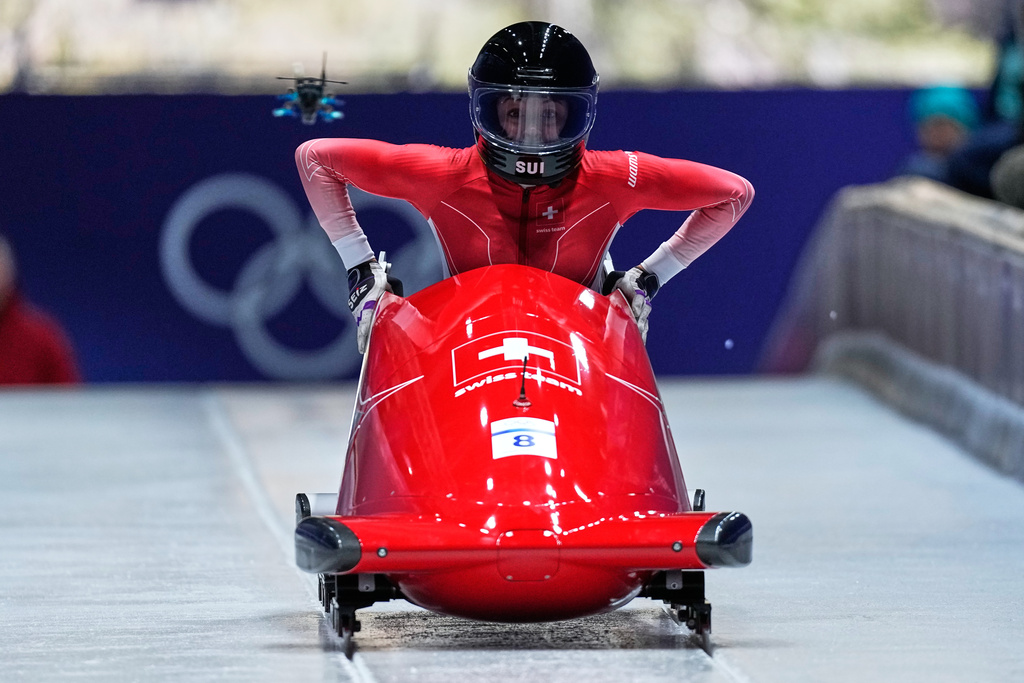 Switzerland's Melanie Hasler starts for a women's monobob run at the 2026 Winter Olympics, in Cortina d'Ampezzo, Italy, Sunday, Feb. 15, 2026. (AP Photo/Aijaz Rahi)