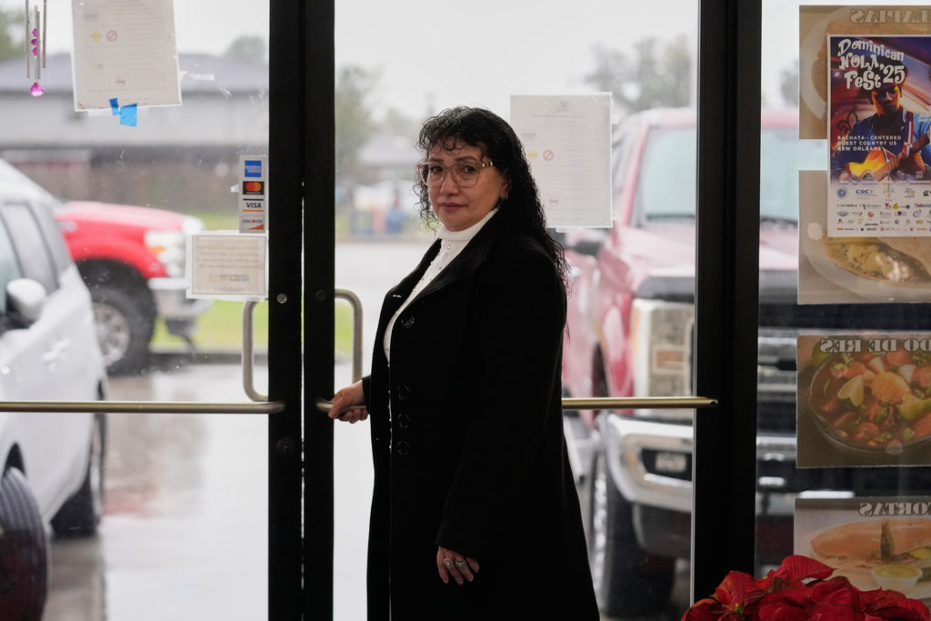 Carmela Diaz poses inside her closed restaurant in the midst of a Customs and Border Protection immigration crackdown in Kenner, La., Thursday, Dec. 4, 2025. (AP Photo/Gerald Herbert)