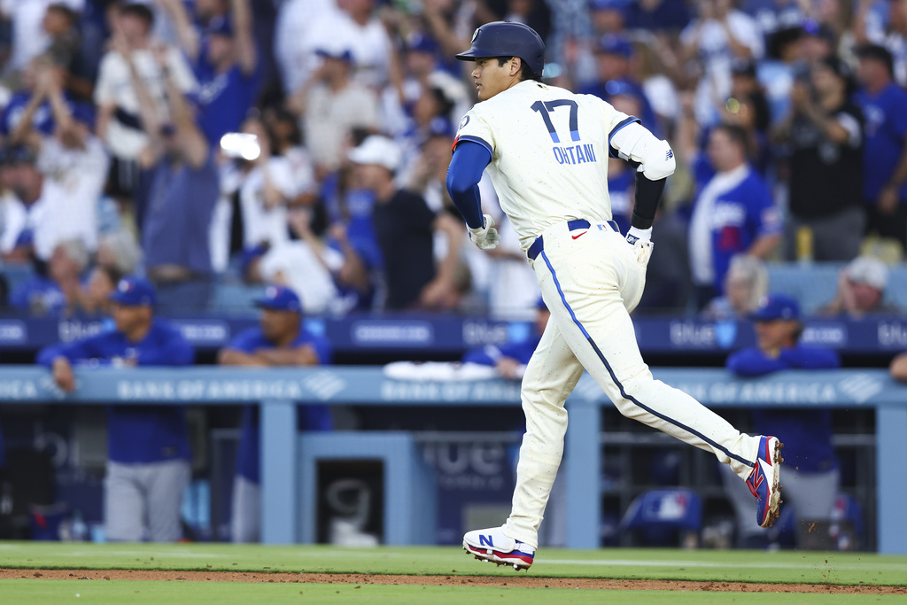 Los Angeles Dodgers' Shohei Ohtani runs after hitting a home run during the fifth inning of a baseball game against the Toronto Blue Jays, Saturday, Aug. 9, 2025, in Los Angeles. (AP Photo/Jessie Alcheh)