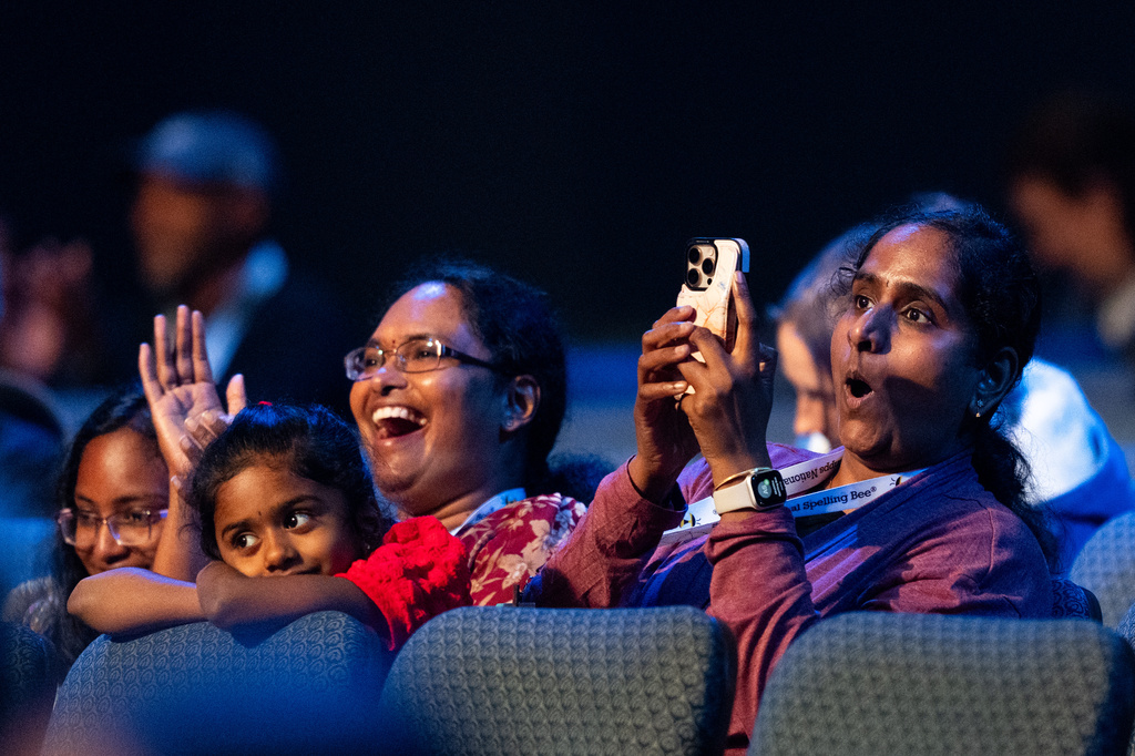 Parents in the audience watch closely during the quarterfinals of the Scripps National Spelling Bee, Wednesday, May 27, 2026, in Washington. (AP Photo/Allison Robbert)