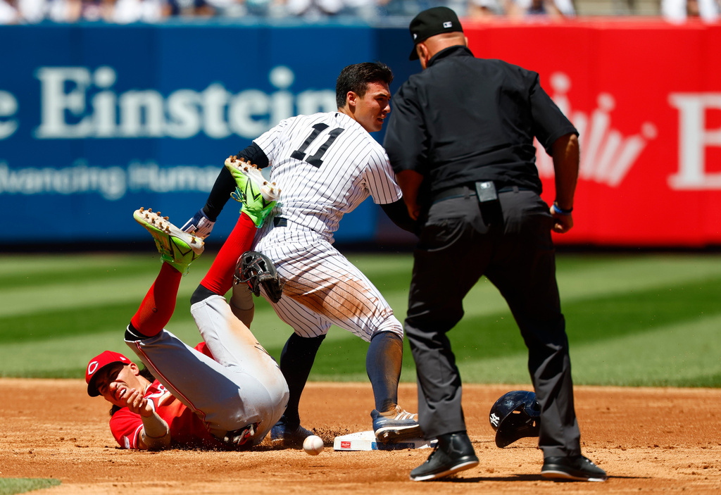 New York Yankees' Anthony Volpe (11) reacts after stealing second base against Cincinnati Reds' Edwin Arroyo (2) during the third inning of a baseball game, Saturday, June 20, 2026, in New York. (AP Photo/Noah K. Murray)