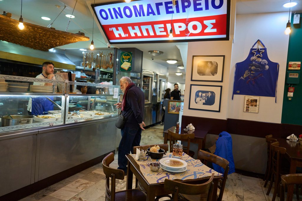 A man orders a traditional tripe soup known as "patsas" in Greek and "iskembe" in Turkish, at Epirus restaurant in central Athens, on Friday, April 3, 2026. (AP Photo/Petros Giannakouris)