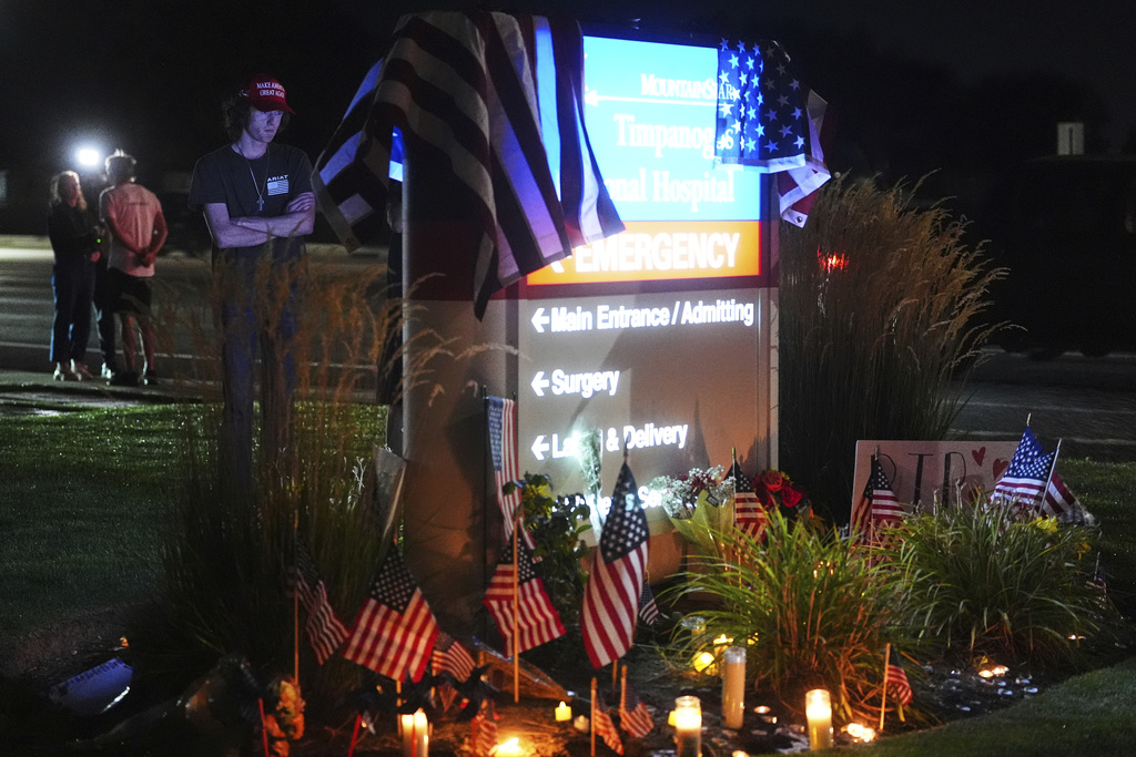 Ammon Paxton, a supporter of Charlie Kirk who witnessed the event as Kirk was shot and killed, visits a growing memorial outside Timpanogos Regional Hospital, Wednesday, Sept. 10, 2025, in Orem, Utah. (AP Photo/Lindsey Wasson)