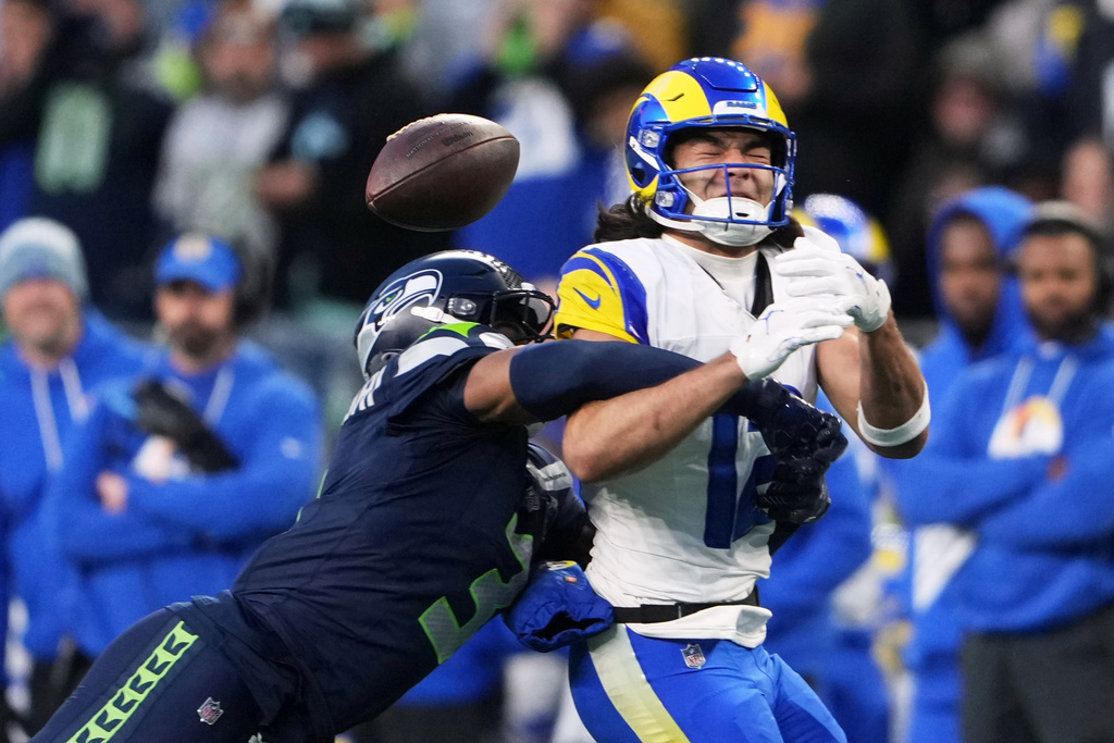 Seattle Seahawks safety Nick Emmanwori, left, breaks up a pass intended for Los Angeles Rams wide receiver Puka Nacua (12) during the first half of the NFC Championship NFL football game Sunday, Jan. 25, 2026, in Seattle. (AP Photo/Lindsey Wasson)