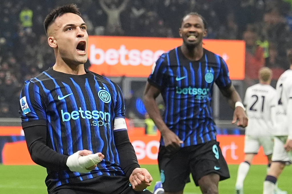 Inter Milan's Lautaro Martinez celebrates after scoring his side's second goal during the Italian Serie A soccer match between Inter and Bologna in Milan, Italy, Sunday, Jan. 4, 2026. (Spada/LaPresse via AP)