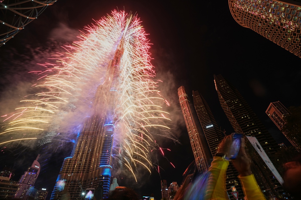 Fireworks explode around the Burj Khalifa, the world's tallest building, during New Year's Eve celebrations in Dubai, United Arab Emirates, Thursday, Jan. 1, 2026. (AP Photo/Fatima Shbair)