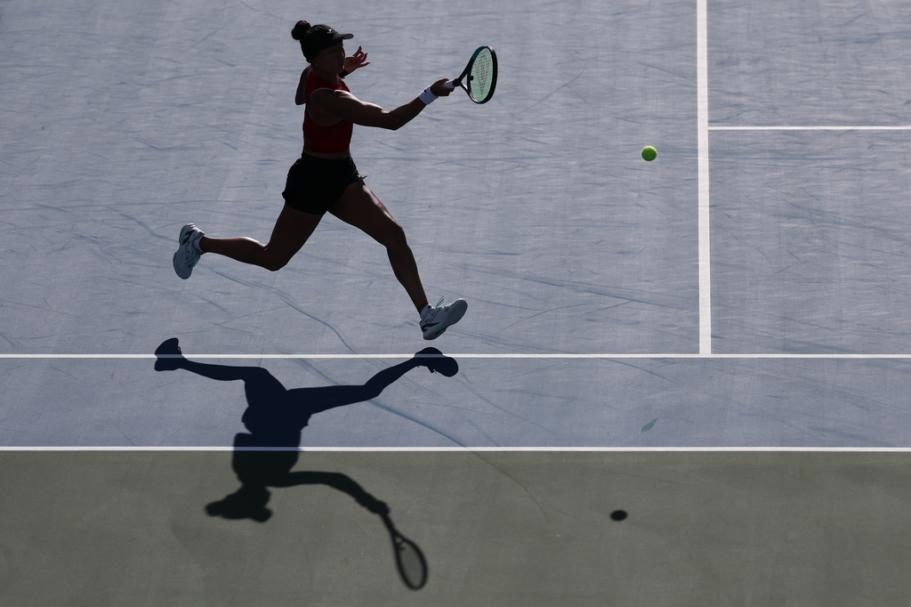 Ann Li, of the United States, returns the ball to Linda Noskova, of the Czech Republic, during the third round of the U.S. Open tennis championships Friday, Sept. 4, 2026, in New York. (AP Photo/Heather Khalifa)